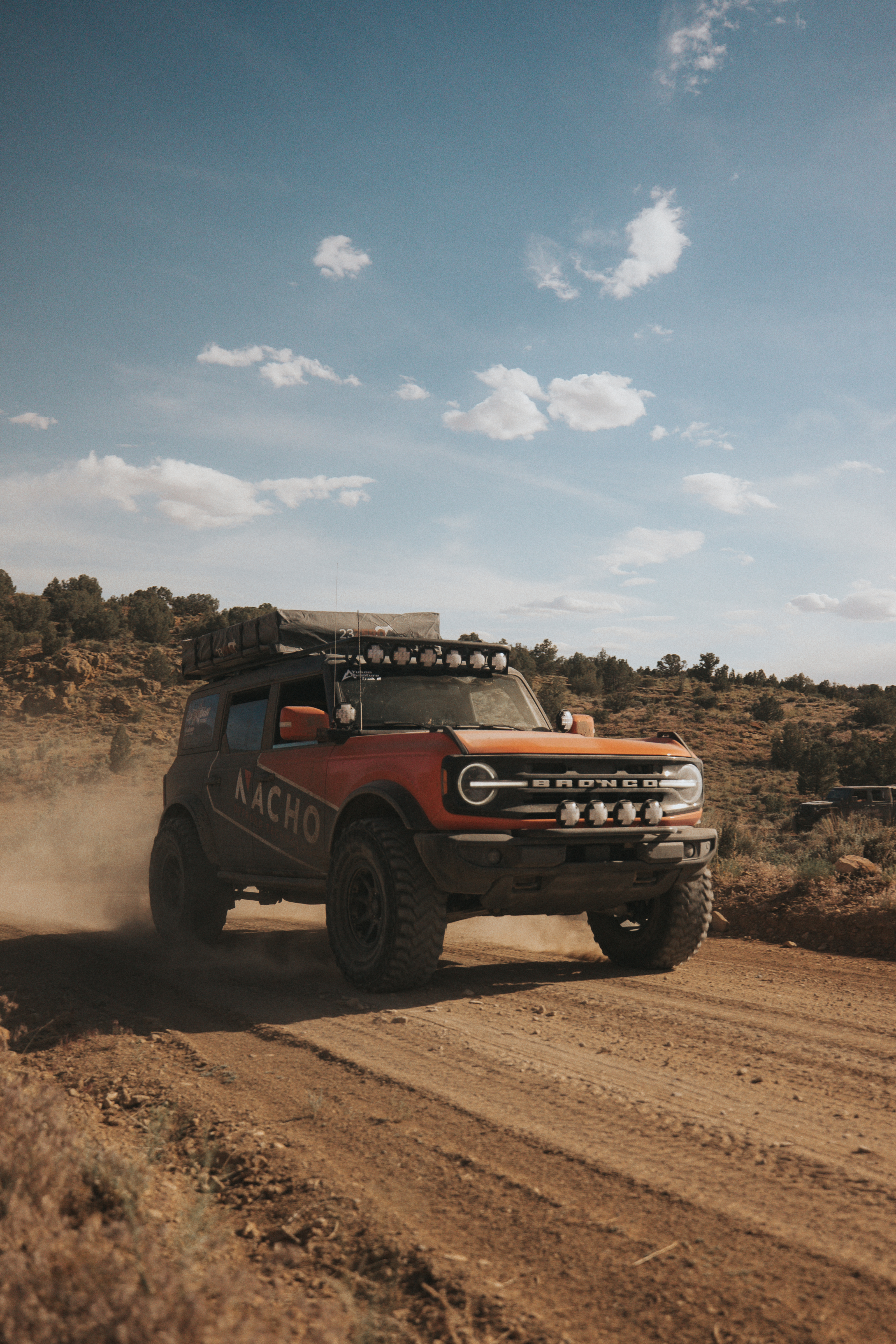 Ford Bronco in Motion with 23Zero Soft Shell Rooftop Tent in Desert