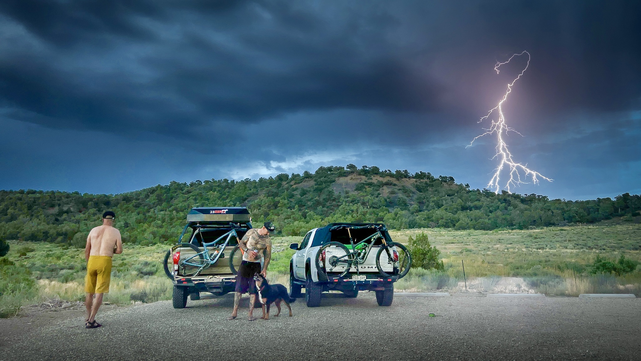 7 Reasons Why To Go Camping 23Zero Two Tacomas Parked with 23Zero Rooftop Tents in Thunderstorm